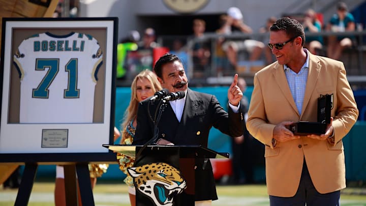 Hall of fame football tackle Tony Boselli looks to Jaguars owner Shad Khan while he was honored at halftime, while his family watched, with his Jacksonville Jaguars number 71 retired. Boselli was enshrined in Canton, Ohio this past August after his seven-season career all with the Jaguars. Sunday, Oct. 9, 2022 at TIAA Bank Field in Jacksonville. The honor took place between the Jacksonville Jaguars and the Houston Texans regular season game. The Texans won 13-6. The Texans won 13-6. [Corey