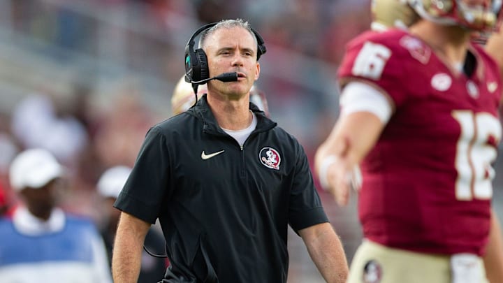 Florida State Seminoles head coach Mike Norvell watches on as his players come off the field. The
