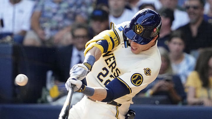 Oct 4, 2025; Milwaukee, Wisconsin, USA; Milwaukee Brewers designated hitter Christian Yelich (22) hits a fly ball against the Chicago Cubs during the sixth inning of game one of the NLDS round for the 2025 MLB playoffs at American Family Field. Mandatory Credit: Michael McLoone-Imagn Images
