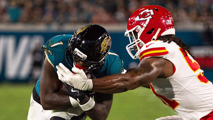 Jacksonville Jaguars running back Travis Etienne (1) is tackled by Kansas City Chiefs defensive end Michael Danna (51) in the first quarter during a Monday Night NFL football game at EverBank Stadium, Monday, Oct. 6, 2025, in Jacksonville, Fla. [Doug EngleFlorida Times-Union]