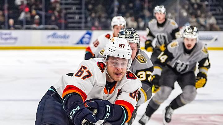 Coachella Valley Firebirds center Mitchell Stephens passes the puck away under pressure from Henderson Silver Knights forward Tuomas Uronen during the first period of their game at Acrisure Arena in Palm Desert, Calif., Wednesday, Jan. 7, 2026. Coachella Valley Firebirds center Mitchell Stephens passes the puck away under pressure from Henderson Silver Knights forward Tuomas Uronen during the first period of their game at Acrisure Arena in Palm Desert, Calif., Wednesday, Jan. 7, 2026.
