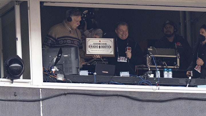 Jan 9, 2022; Cleveland, Ohio, USA; Cleveland Browns radio color analyst Doug Dieken (left) is presented with a plaque by radio play-by-play announcer Jim Donovan for the radio booth dedication for his retirement from announcing Cleveland Browns football games during the first half against the Cincinnati Bengals at FirstEnergy Stadium. Mandatory Credit: Scott Galvin-Imagn Images