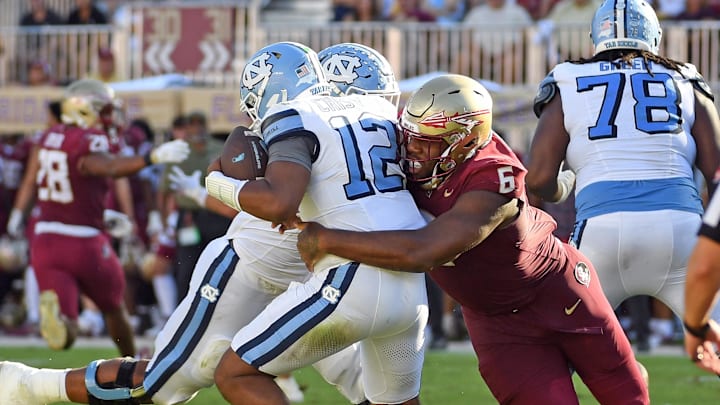 Nov 2, 2024; Tallahassee, Florida, USA; Florida State Seminoles defensive tackle Darrell Jackson Jr (6) sacks North Carolina Tarheels quarterback Jacolby Criswell (12) in the second quarter at Doak S. Campbell Stadium. Mandatory Credit: Robert Myers-Imagn Images Nov 2, 2024; Tallahassee, Florida, USA; Florida State Seminoles defensive tackle Darrell Jackson Jr (6) sacks North Carolina Tarheels quarterback Jacolby Criswell (12) in the second quarter at Doak S. Campbell Stadium. Mandatory Credit: Robert Myers-Imagn Images