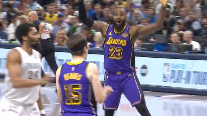 LeBron James reacts to Austin Reaves’s putback dunk against the Mavericks.