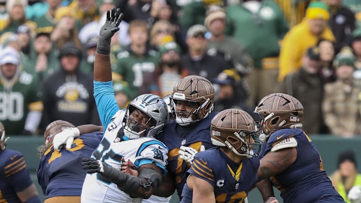 Nov 2, 2025; Green Bay, Wisconsin, USA; Carolina Panthers defensive end Derrick Brown (95) rushes Green Bay Packers quarterback Jordan Love (10) during the game at Lambeau Field. Mandatory Credit: Tork Mason-USA TODAY Network via Imagn Images