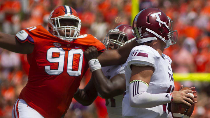 Sep 10, 2016; Clemson, SC, USA; Clemson Tigers defensive tackle Dexter Lawrence (90) attempts to tackle Troy Trojans quarterback Kaleb Barker (18) during the second quarter at Clemson Memorial Stadium. Mandatory Credit: Joshua S. Kelly-Imagn Images