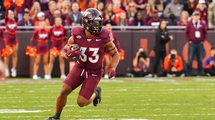Nov 9, 2024; Blacksburg, Virginia, USA; Virginia Tech Hokies running back Bhayshul Tuten (33) runs after a catch against the Clemson Tigers at Lane Stadium. Mandatory Credit: Brian Bishop-Imagn Images Nov 9, 2024; Blacksburg, Virginia, USA; Virginia Tech Hokies running back Bhayshul Tuten (33) runs after a catch against the Clemson Tigers at Lane Stadium. Mandatory Credit: Brian Bishop-Imagn Images