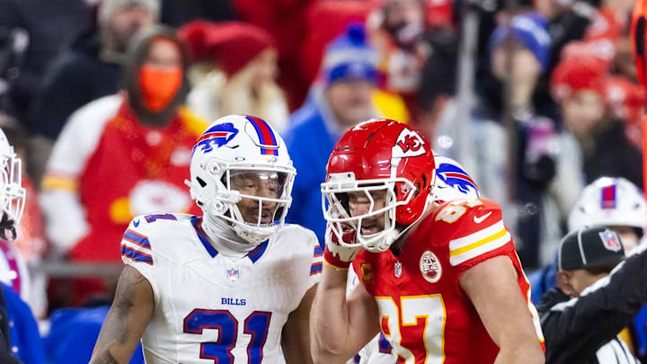 Kansas City Chiefs tight end Travis Kelce (87) reacts as he talks to Buffalo Bills cornerback Rasul Douglas (31) during the AFC Championship game at GEHA Field at Arrowhead Stadium last season.