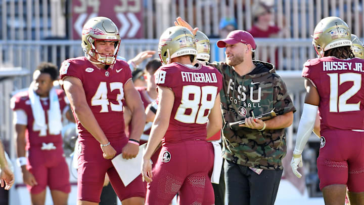 Nov 2, 2024; Tallahassee, Florida, USA;  Florida State Seminoles kicker Ryan Fitzgerald (88) celebrates with teammates after kicking a 56-yard field goal against the North Carolina Tarheels at Doak S. Campbell Stadium during the first half. Mandatory Credit: Robert Myers-Imagn Images