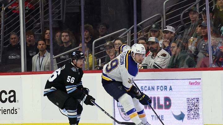 Sep 22, 2024; Des Moines, Iowa, USA;  St. Louis Blues Dylan Peterson (39) skates away from Utah Hockey Club forward Kailer Yamamoto (56) at Wells Fargo Arena. Utah beat St. Louis 5 to 3. Mandatory Credit: Reese Strickland-Imagn Images