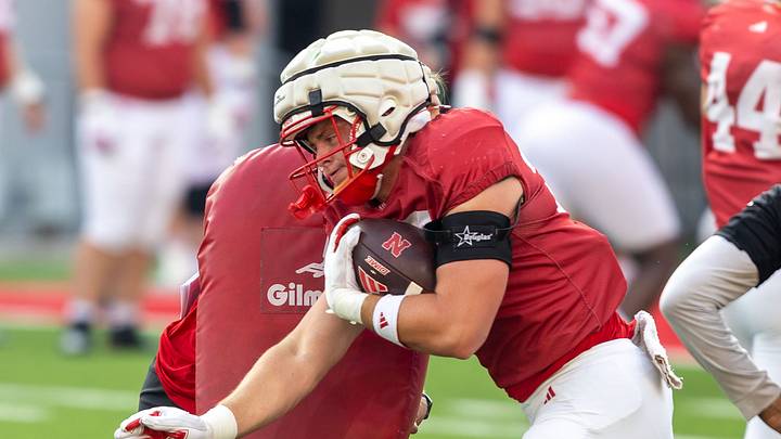 Nebraska tight end Carter Nelson runs through a block during a drill. Nebraska tight end Carter Nelson runs through a block during a drill.