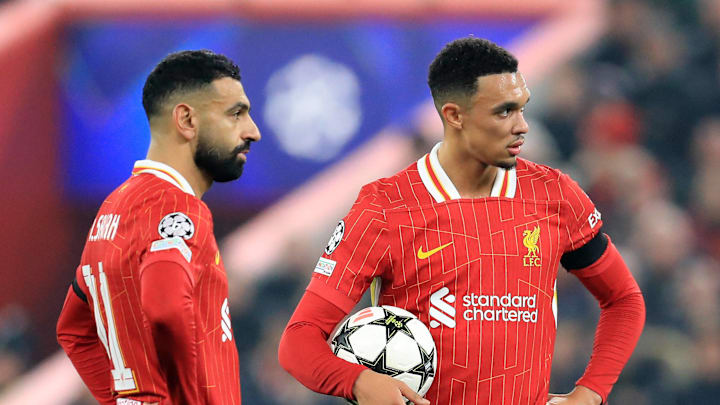 Mohamed Salah and Trent Alexander-Arnold stand over a free-kick for Liverpool