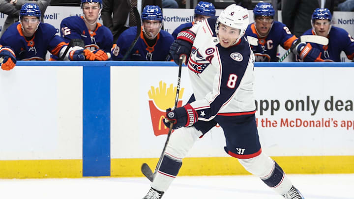 Jan 20, 2025; Elmont, New York, USA;  Columbus Blue Jackets defenseman Zach Werenski (8) attempts a shot on goal in the third period against the New York Islanders at UBS Arena. Mandatory Credit: Wendell Cruz-Imagn Images
