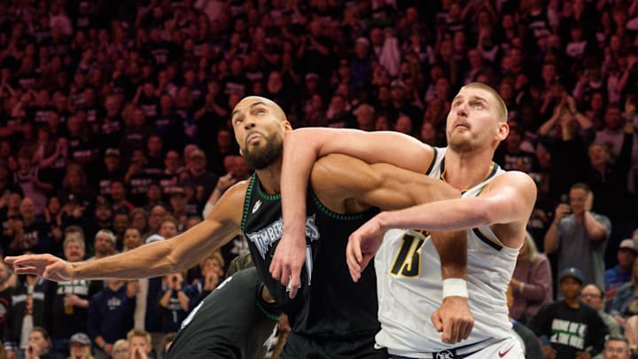 Apr 25, 2026; Minneapolis, Minnesota, USA; Minnesota Timberwolves center Rudy Gobert (27) and Denver Nuggets center Nikola Jokic (15) position themselves for a rebound in the fourth quarter at Target Center. Mandatory Credit: Matt Blewett-Imagn Images
