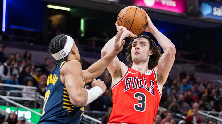 Mar 2, 2025; Indianapolis, Indiana, USA; Chicago Bulls guard Josh Giddey (3) shoots the ball while Indiana Pacers guard Andrew Nembhard (2) defends in the first half  at Gainbridge Fieldhouse. Mandatory Credit: Trevor Ruszkowski-Imagn Images