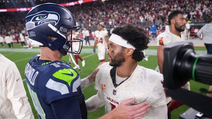 Arizona Cardinals quarterback Kyler Murray (1) meets Seattle Seahawks quarterback Sam Darnold (14) after the Seahawks' 23-20 win at State Farm Stadium in Glendale on Sept. 25, 2025.