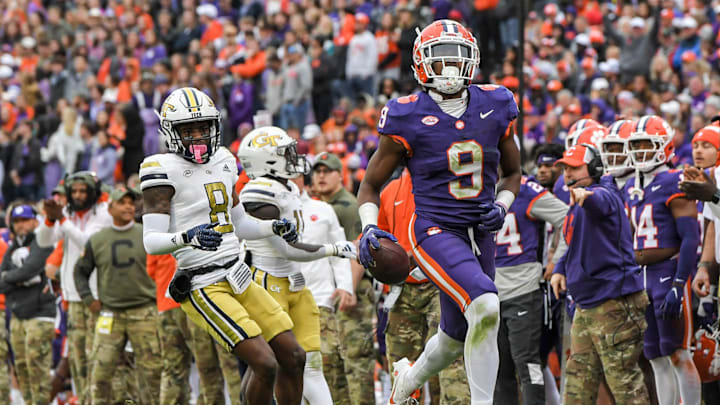 Clemson safety R.J. Mickens (9) runs with a ball near Georgia Tech receiver Malik Rutherford (8) during the third quarter Nov 11, 2023; Clemson, South Carolina, USA; at Memorial Stadium.