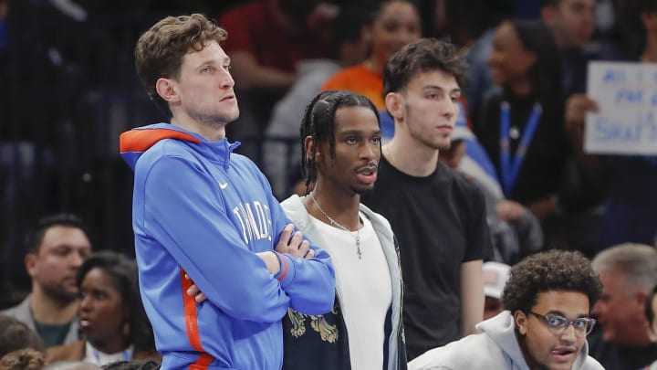 Dec 17, 2022; Oklahoma City, Oklahoma, USA; Oklahoma City Thunder center Mike Muscala (33), guard Shai Gilgeous-Alexander (2), forward Jeremiah Robinson-Earl (50) and forward Chet Holmgren (7) watch their team play against the Memphis Grizzlies during the second half at Paycom Center. Oklahoma City won 115-109. Mandatory Credit: Alonzo Adams-USA TODAY Sports