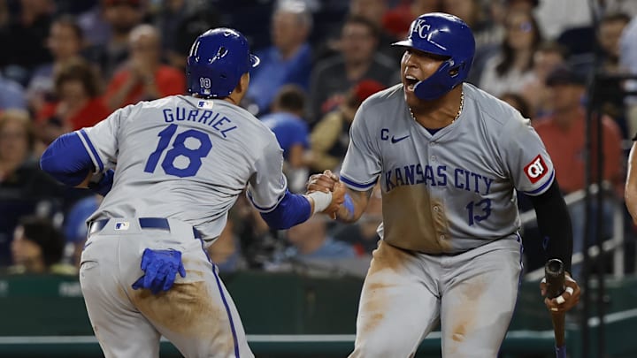 Kansas City Royals catcher Salvador Perez (13) and Royals first baseman Yuli Gurriel celebrate after scoring runs during a game against the Washington Nationals on Wednesday at Nationals Park.