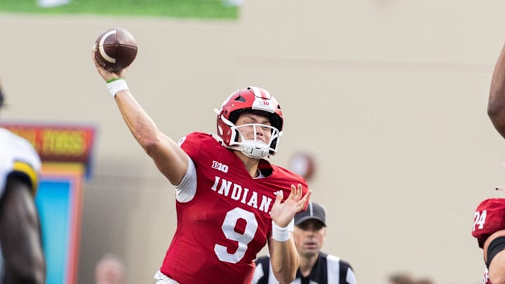 Indiana Hoosiers quarterback Kurtis Rourke (9) passes the ball in the second quarter against the Michigan Wolverines at Memorial Stadium. 