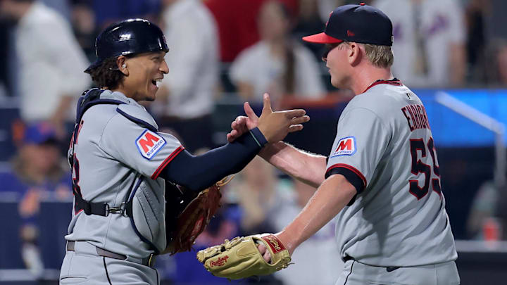 Aug 4, 2025; New York City, New York, USA; Cleveland Guardians catcher Bo Naylor (23) and relief pitcher Nic Enright (59) celebrate after defeating the New York Mets in ten innings at Citi Field. Mandatory Credit: Brad Penner-Imagn Images