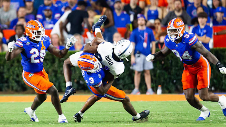 Florida Gators defensive back Jason Marshall Jr. (3) tackles Samford Bulldogs wide receiver Preston Bird (84) during the second half at Ben Hill Griffin Stadium in Gainesville, FL on Saturday, September 7, 2024 against the Samford Bulldogs. The Florida Gators won 45-7 over the Bulldogs. [Doug Engle/Gainesville Sun]