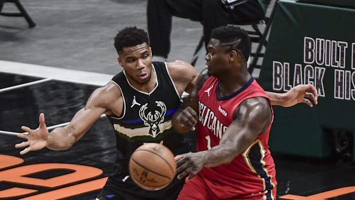 Feb 25, 2021; Milwaukee, Wisconsin, USA; Milwaukee Bucks forward Giannis Antetokounmpo (34) pressures New Orleans Pelicans forward Zion Williamson (1) in the third quarter at Fiserv Forum. Mandatory Credit: Benny Sieu-Imagn Images