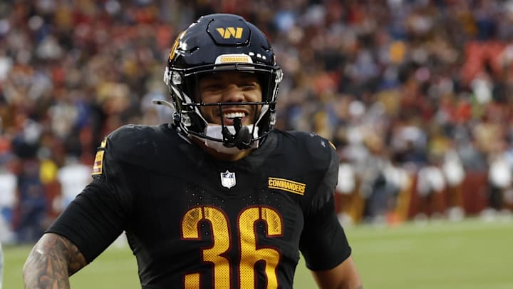 Dec 1, 2024; Landover, Maryland, USA; Washington Commanders running back Chris Rodriguez Jr. (36) celebrates after scoring a touchdown against the Tennessee Titans during the fourth quarter at Northwest Stadium. Mandatory Credit: Geoff Burke-Imagn Images