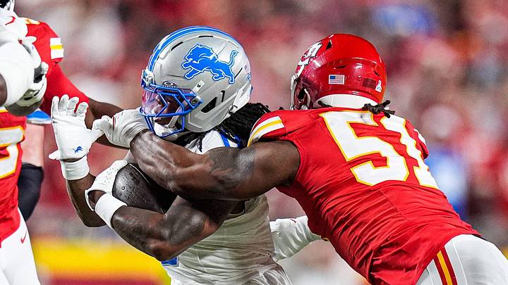 Detroit Lions running back Jahmyr Gibbs (0) runs against Kansas City Chiefs defensive end Mike Danna (51) during the first half at Arrowhead Stadium in Kansas City, Missouri on Sunday, Oct. 12, 2025.