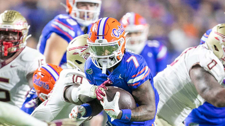 Florida Gators running back Trevor Etienne (7) makes yards during first half action as Florida takes