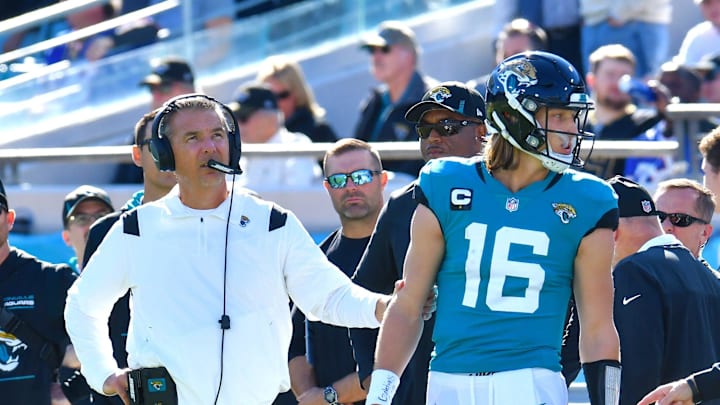Jacksonville Jaguars head coach Urban Meyer holds Jacksonville Jaguars quarterback Trevor Lawrence (16) at TIAA Bank Field in Jacksonville, FL, Sunday, November 7, 2021.
