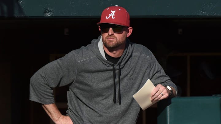 Feb 23, 2024; Tuscaloosa, Alabama, USA; Alabama head coach Rob Vaughn stands on the dugout steps during the opening game of the weekend series with Valparaiso at Sewell-Thomas Stadium.