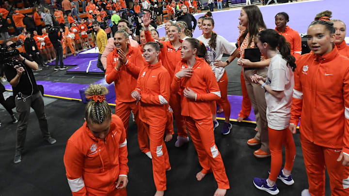 Clemson celebrates their win after the first meet