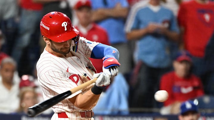 Philadelphia Phillies shortstop Trea Turner (7) hits an RBI single against the Los Angeles Dodgers in the eighth inning during game two of the NLDS round for the 2025 MLB playoffs at Citizens Bank Park. 