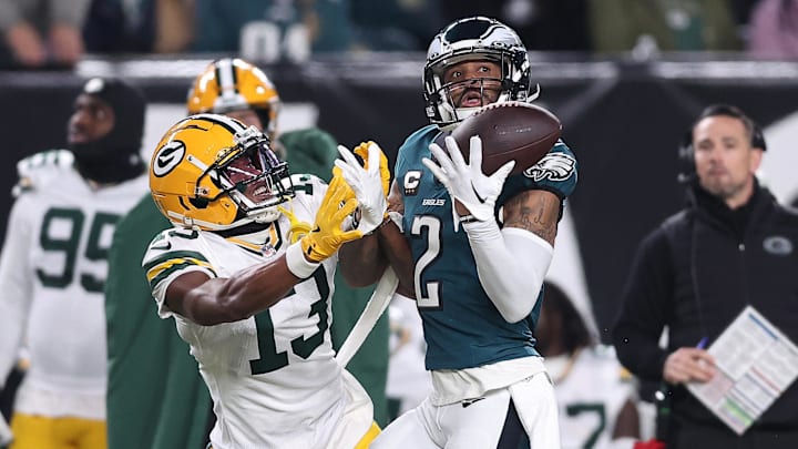Philadelphia Eagles cornerback Darius Slay Jr. (2) makes an interception against Green Bay Packers receiver Dontayvion Wicks.