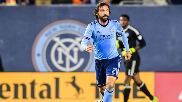 Nov 5, 2017; New York, NY, USA; New York City FC midfielder Andrea Pirlo (21) brings the ball up the field during the game against Columbus Crew in the 2nd half of the Eastern Conference semifinal at Yankee Stadium.  Mandatory Credit: Dennis Schneidler-Imagn Images