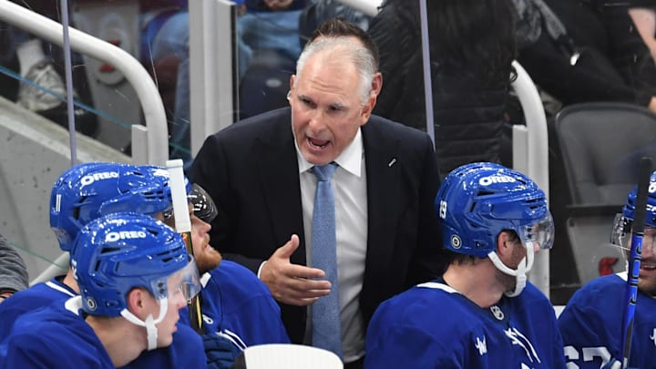 Sep 22, 2024; Toronto, Ontario, CAN;  Toronto Maple Leafs head coach Craig Berube speaks with his players in the second period against the Ottawa Senators at Scotiabank Arena. Mandatory Credit: Dan Hamilton-Imagn Images