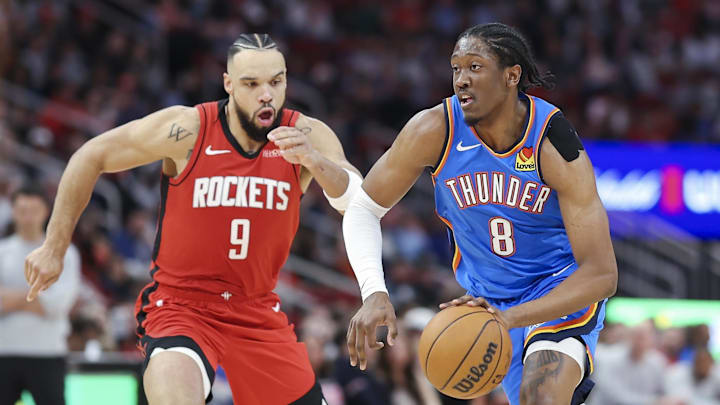 Dec 1, 2024; Houston, Texas, USA; Oklahoma City Thunder forward Jalen Williams (8) dribbles the ball as Houston Rockets forward Dillon Brooks (9) defends during the game at Toyota Center. Mandatory Credit: Troy Taormina-Imagn Images