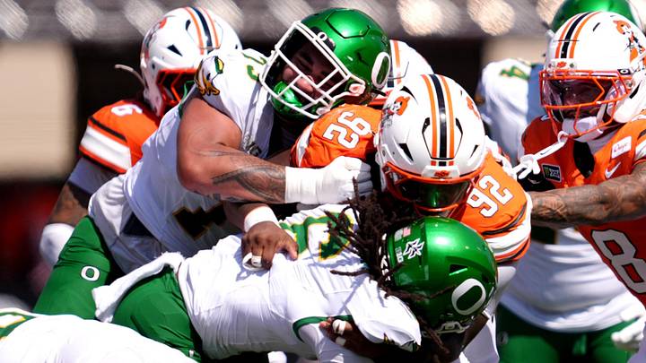 Oklahoma State's Jerry Lawson (92) tackles Oregon's Dierre Hill Jr. (6) second half of the college football game between the Oklahoma State Cowboys and the Oregon Ducks at Boone Pickens Stadium in Stillwater, Okla., Saturday, Sept., 12, 2026.