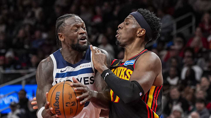 Dec 31, 2025; Atlanta, Georgia, USA; Minnesota Timberwolves forward Julius Randle (30) and Atlanta Hawks forward Onyeka Okongwu (17) battle near the basket during the second half at State Farm Arena. Mandatory Credit: Dale Zanine-Imagn Images