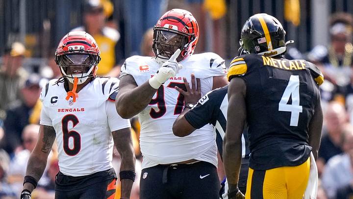 Cincinnati Bengals defensive tackle Dexter Lawrence II (97) points to Pittsburgh Steelers wide receiver Dk Metcalf (4) as they exchange words in the second quarter of the NFL Week 3 game between the Pittsburgh Steelers and the Cincinnati Bengals at Acrisure Stadium in Pittsburgh on Sunday, Sept. 27, 2026. The game was tied at 17 at halftime.