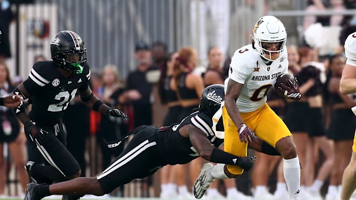Sep 6, 2025; Starkville, Mississippi, USA; Arizona State Sun Devils running back Raleek Brown (3) runs the ball as Mississippi State Bulldogs linebacker Nic Mitchell (40) attempts to make the tackle during the first quarter at Davis Wade Stadium at Scott Field. Mandatory Credit: Petre Thomas-Imagn Images