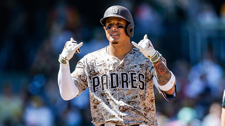 Apr 13, 2025; San Diego, California, USA; San Diego Padres third baseman Manny Machado (13) reacts after hitting a double during the seventh inning against the Colorado Rockies at Petco Park. Mandatory Credit: David Frerker-Imagn Images