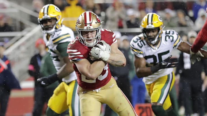  San Francisco 49ers running back Christian McCaffrey scores a touchdown against the Packers during last year's playoffs.