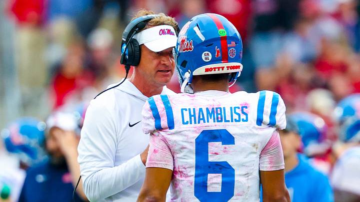 Oct 25, 2025; Norman, Oklahoma, USA; Ole Miss Rebels head coach Lane Kiffin speaks with Ole Miss Rebels quarterback Trinidad Chambliss (6) during the second half at Gaylord Family-Oklahoma Memorial Stadium. Mandatory Credit: Kevin Jairaj-Imagn Images Oct 25, 2025; Norman, Oklahoma, USA; Ole Miss Rebels head coach Lane Kiffin speaks with Ole Miss Rebels quarterback Trinidad Chambliss (6) during the second half at Gaylord Family-Oklahoma Memorial Stadium. Mandatory Credit: Kevin Jairaj-Imagn Images