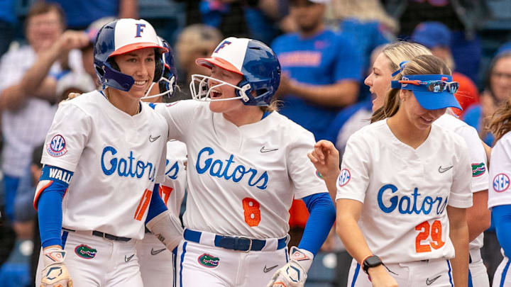 Florida shortstop Skylar Wallace (17) and Florida catcher Jocelyn Erickson (8) celebrate Wallace   s
