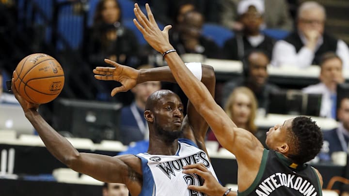 Jan 2, 2016; Minneapolis, MN, USA; Minnesota Timberwolves forward Kevin Garnett (21) looks to pass as Milwaukee Bucks forward Giannis Antetokounmpo (34) defends him in the first quarter at Target Center. The Bucks win 95-85. Mandatory Credit: Bruce Kluckhohn-Imagn Images