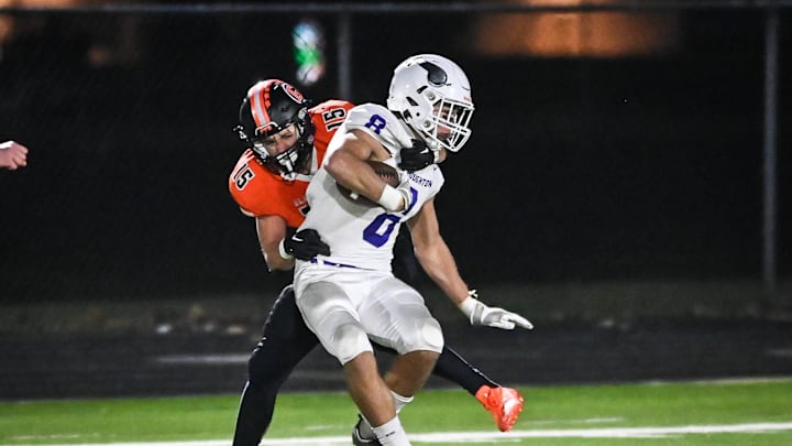 Grafton s Tyler Heinle (15) pulls down Stoughton s Mason Richter (8) after a short catch in a Division 3 state semifinal Friday, November 10, 2023, at Waukesha West High School in Waukesha, Wisconsin. Grafton s Tyler Heinle (15) pulls down Stoughton s Mason Richter (8) after a short catch in a Division 3 state semifinal Friday, November 10, 2023, at Waukesha West High School in Waukesha, Wisconsin.