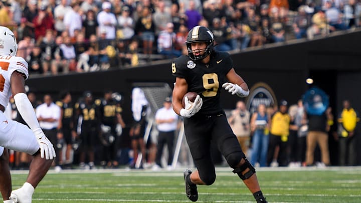Oct 26, 2024; Nashville, Tennessee, USA;  Vanderbilt Commodores tight end Eli Stowers (9) runs the ball as Texas Longhorns defensive back Jelani McDonald (25) during the first half at FirstBank Stadium. Mandatory Credit: Steve Roberts-Imagn Images