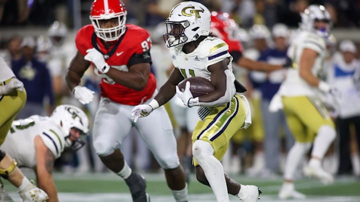 Nov 25, 2023; Atlanta, Georgia, USA; Georgia Tech Yellow Jackets running back Jamal Haynes (11) runs the ball against the Georgia Bulldogs in the second quarter at Bobby Dodd Stadium at Hyundai Field. Mandatory Credit: Brett Davis-Imagn Images